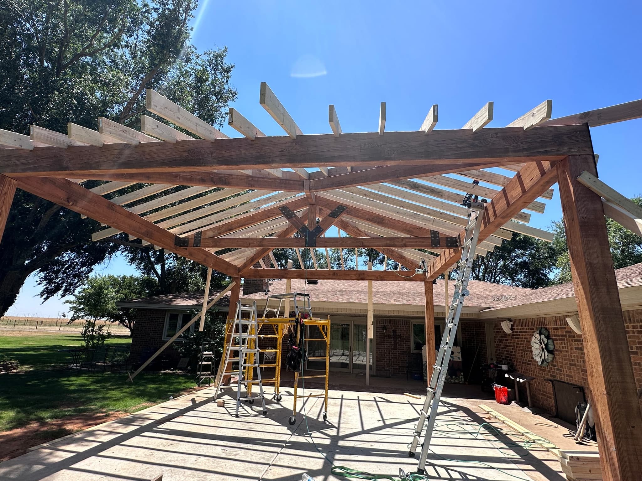 Hip rafters and king-post truss up, ready for decking