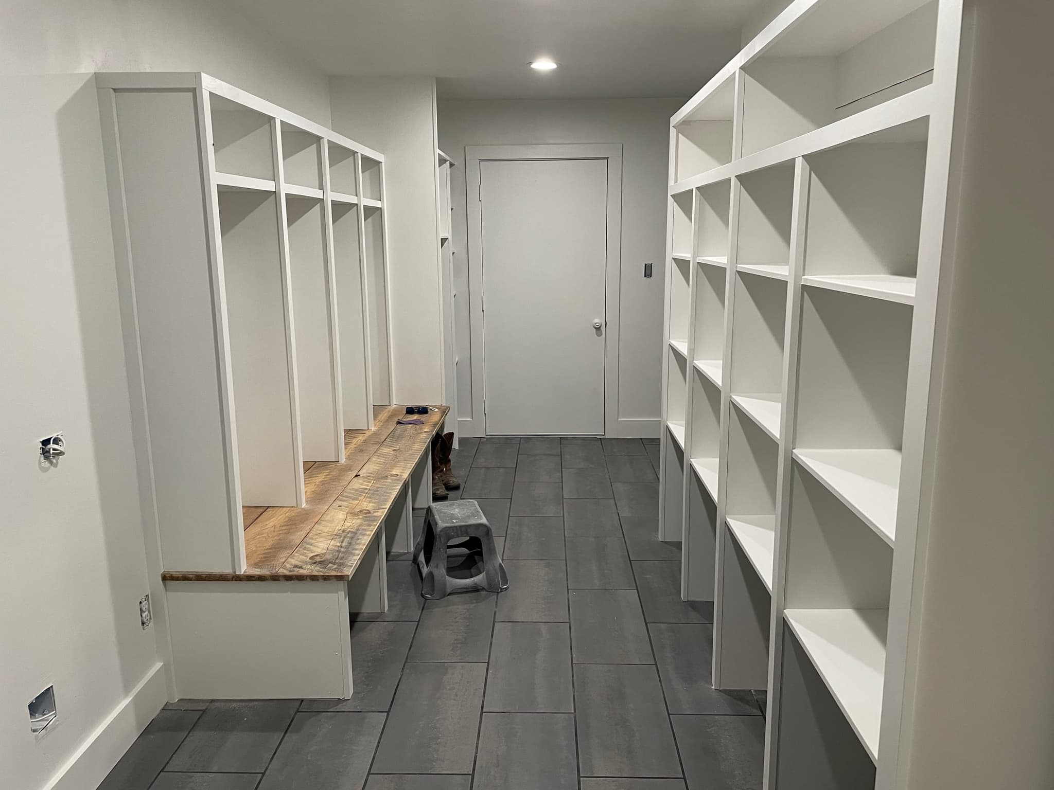 Mudroom and pantry millwork — bench, cubbies and adjustable shelving built on site